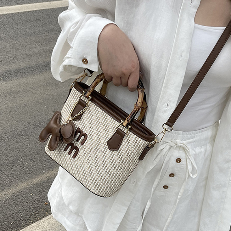Free shipping 2025 designer bag new spring basket bag fashion contrast straw woven bag bamboo vegetable Bucket Bag Handbag single shoulder bag straddl