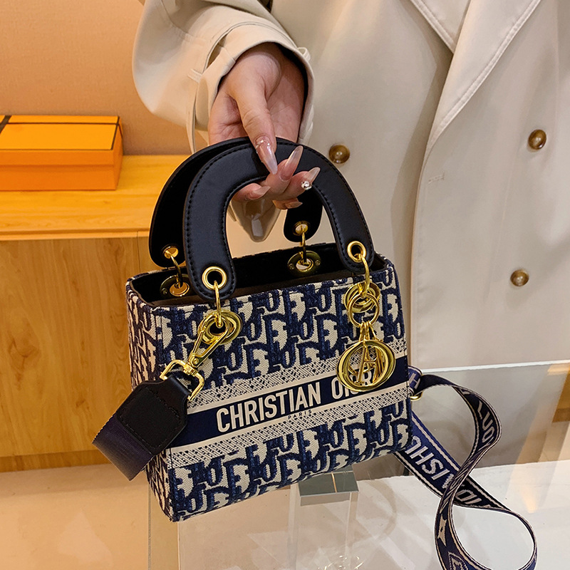 The new women's handbag is simple and fashionable, with a large capacity and exquisite embroidery. It is a portable handbag for women and a cross