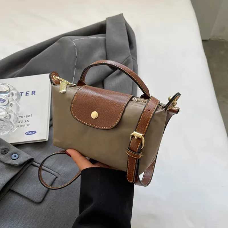 2025 Womens Mini Garbage Handbag High end Nylon Fabric Fashion Shoulder/Cross shaped Mobile Phone Bag M250516