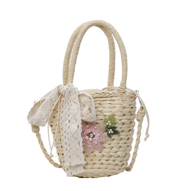 2025S designer women grass rattan new crossbody shoulder internet famous hand woven beach bucket bag
