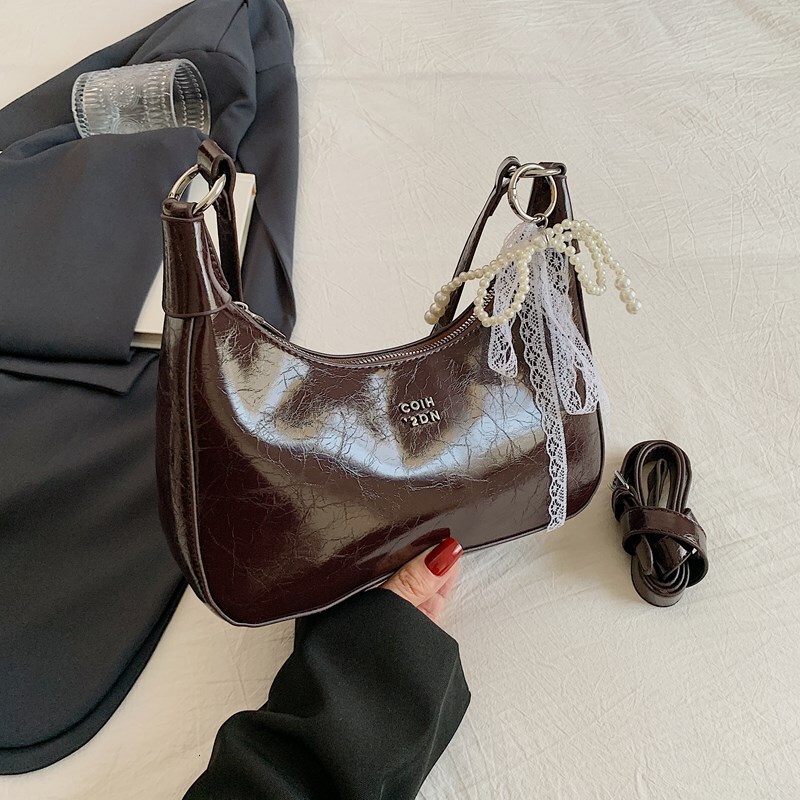 2025S designer high-end sense niche women new trendy summer style shoulder wrinkled texture underarm bag