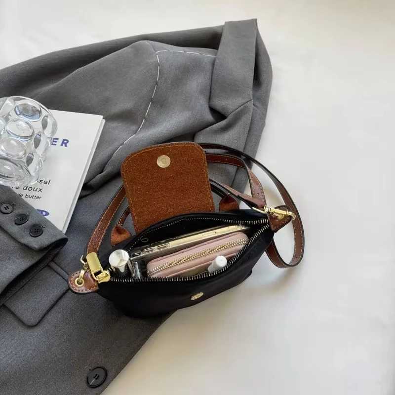 2025 Womens Mini Garbage Handbag High end Nylon Fabric Fashion Shoulder/Cross shaped Mobile Phone Bag M250516