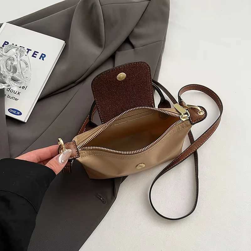 2025 Womens Mini Garbage Handbag High end Nylon Fabric Fashion Shoulder/Cross shaped Mobile Phone Bag M250516