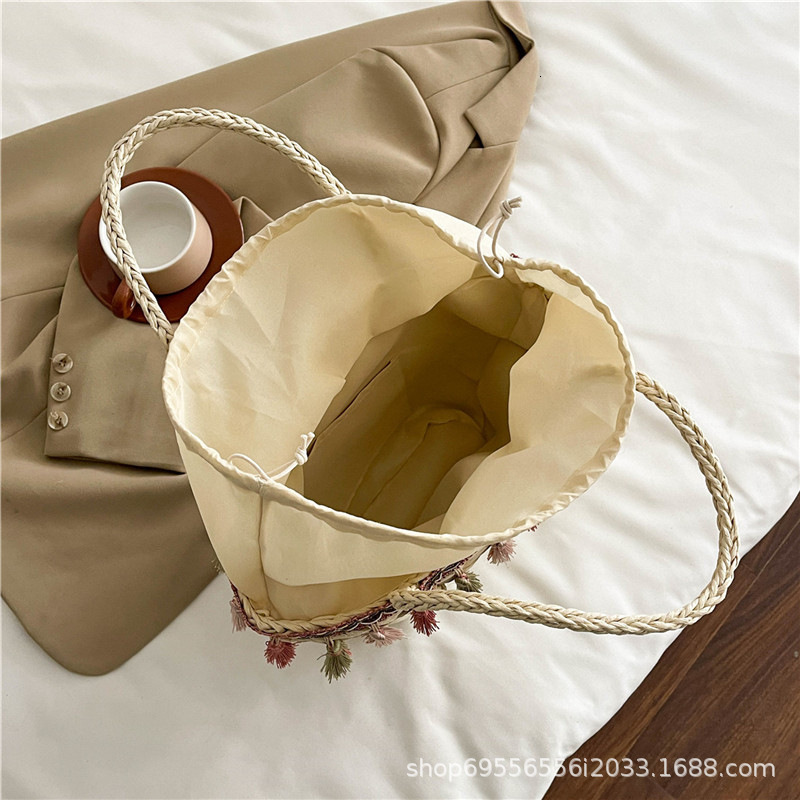 2025S Designer Straw Women New Fashionable and Versatile Large Capacity Bucket Beach Woven Handheld Vegetable Basket Bag