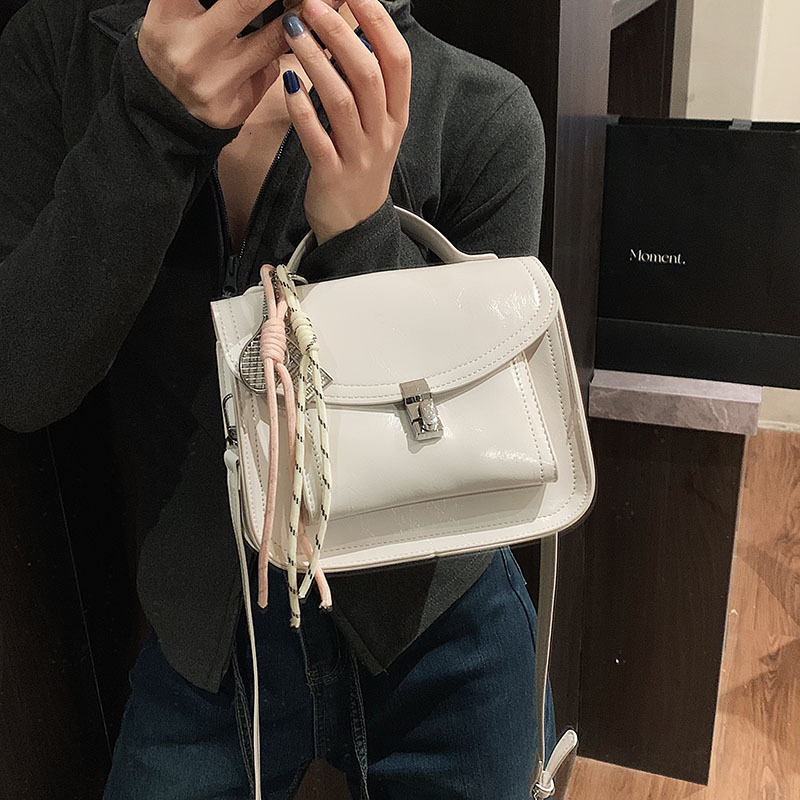 2025 Women's Lock Shoulder Cross Bag Free Shipping Designer Korean Edition Multi Functional Postman Handheld Small Square Bag Simple Leisure Comm