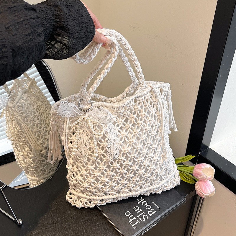 2025S designer large capacity hollow hand women summer new vacation beach shoulder leisure water bucket straw woven bag small square bag