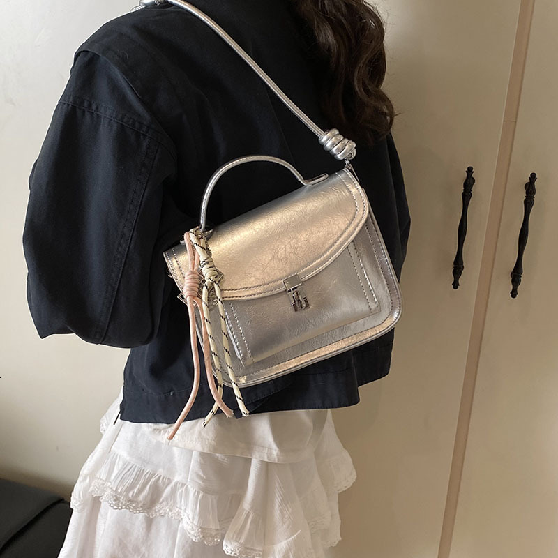 2025 Women's Lock Shoulder Cross Bag Free Shipping Designer Korean Edition Multi Functional Postman Handheld Small Square Bag Simple Leisure Comm