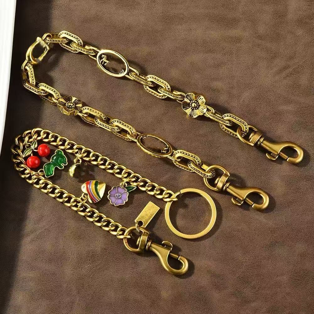 Fashion Dinosaur Cherry Charm Accessories Designer Womens Bag or Keychain Pendant co ch Cherry Decoration Personalized Womens Wallet chain Bracelet dhgate