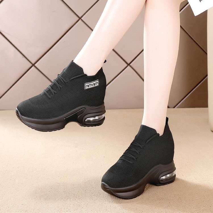 Black sporty women's round and wide toe shoes, designed with soft soles and comfortable surfaces, featuring an inner height increase