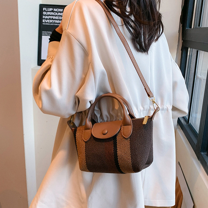 2025 Free Shipping Designer Women's Bag Shoulder Bag Summer New Tote Pattern Handbag High Quality Fashion Casual Crossbody Bag Makeup Bag