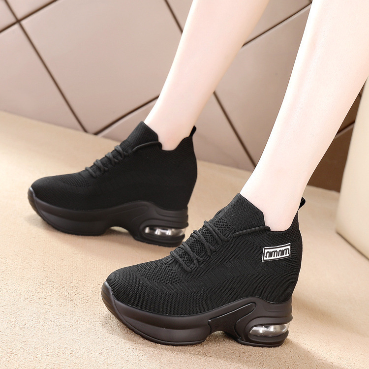 Black sporty women's round and wide toe shoes, designed with soft soles and comfortable surfaces, featuring an inner height increase