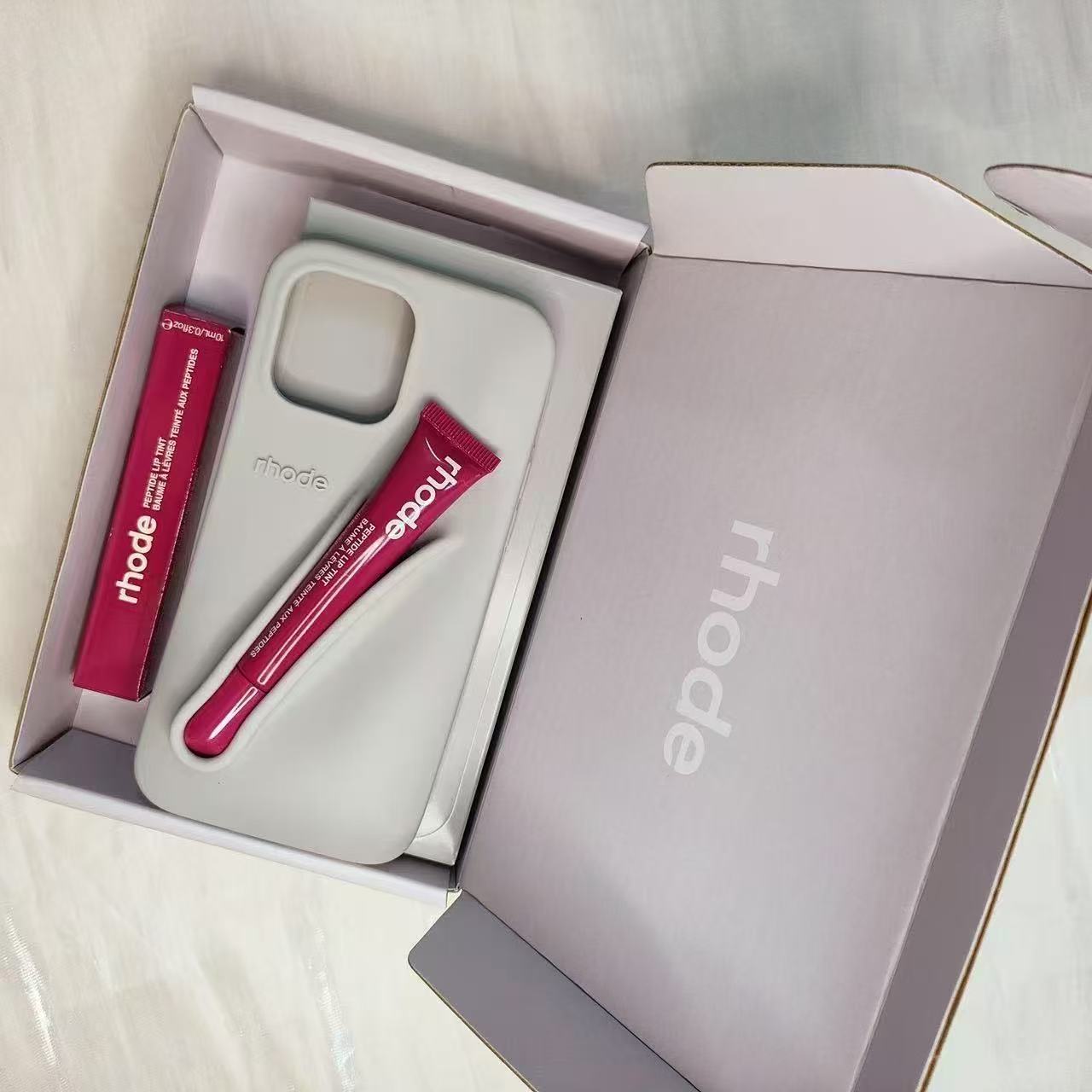 2025 rhode 3-in-1 Lip Gloss Phone Case for iPhone 16/15/14 Pro Max/Plus/13/12 - Built-in Lipstick/Lip Balm Holder with 3D Silicone Cover & Strap