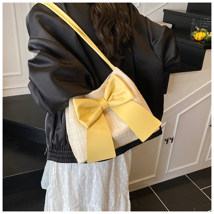 Free Shipping 2025S designer New Summer Grass Weaving Women Underarm New Soft and Elegant Bow shaped Bucket Multi functional Shoulder Bag