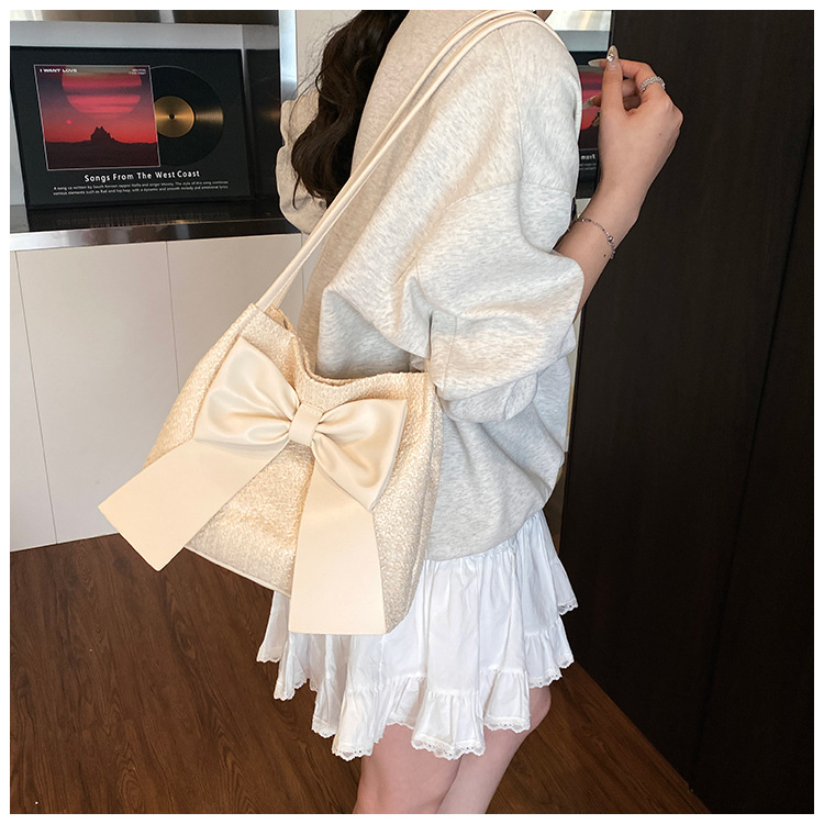 Free Shipping 2025S designer New Summer Grass Weaving Women Underarm New Soft and Elegant Bow shaped Bucket Multi functional Shoulder Bag