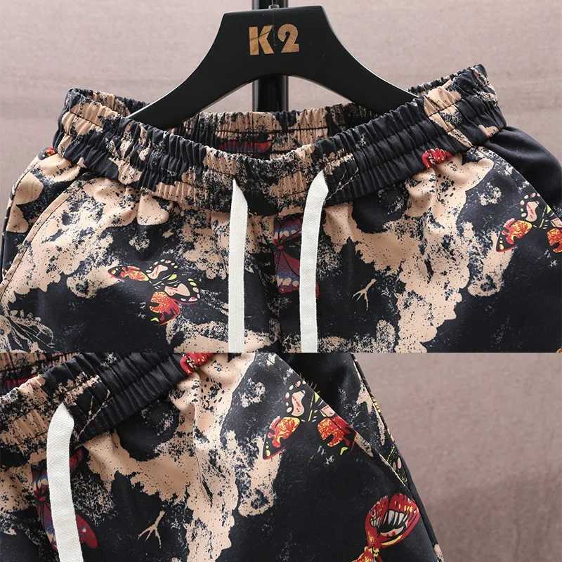 New summer mens Shorts Men Womens fashion beach seaside casual shorts mesh Sports Beach Shorts quarter pants J250515QK0S