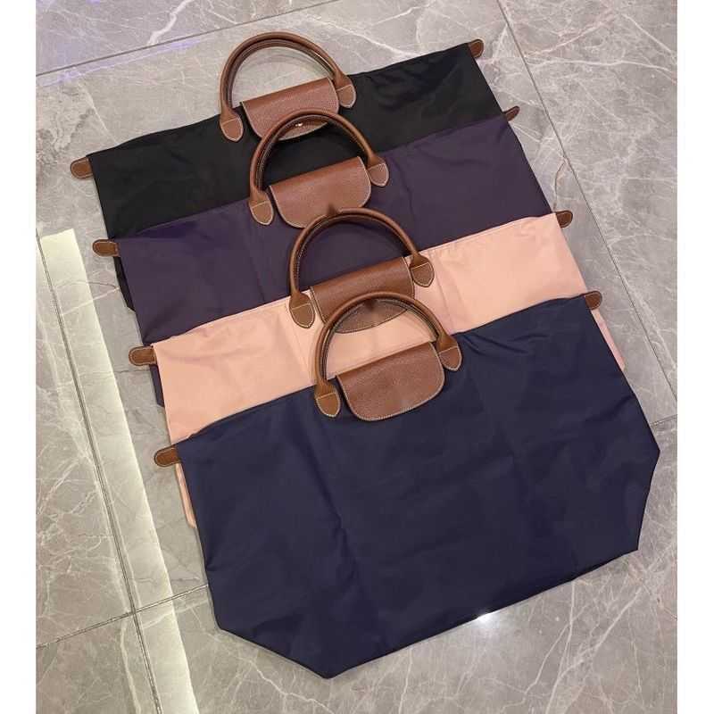26ss Foldable Travel Bag Female Handheld Large Capacity Lightweight Waterproof Luggage Bag Storage Business Trip Travel Gym Bag