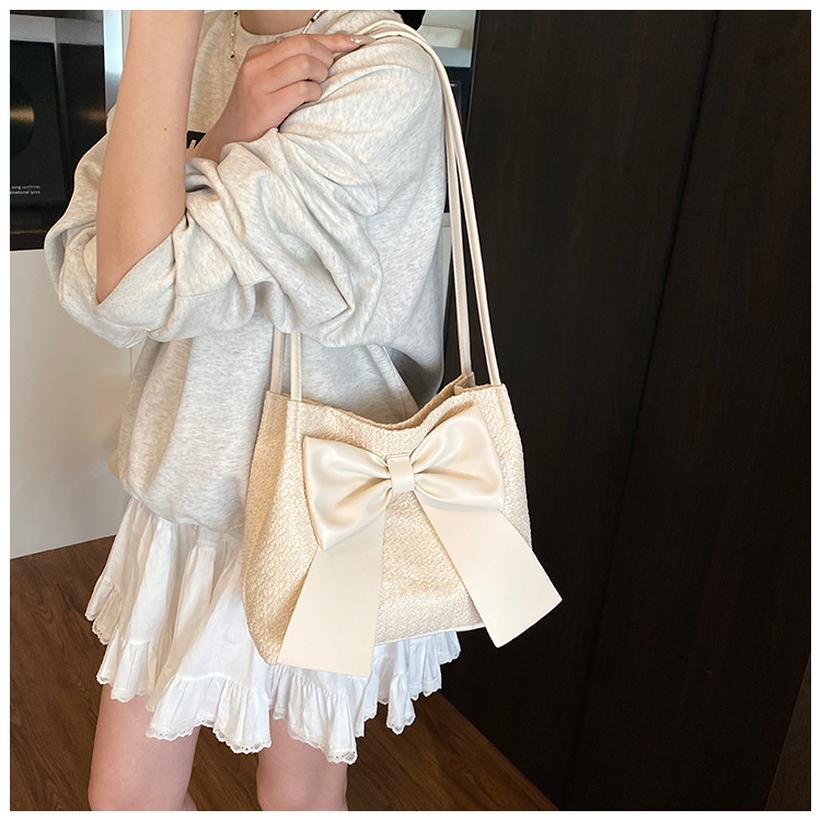 Free Shipping 2025S designer New Summer Grass Weaving Women Underarm New Soft and Elegant Bow shaped Bucket Multi functional Shoulder Bag