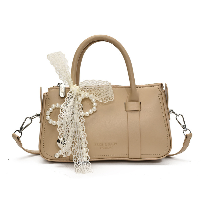 Korean version of fashionable hand-held pillow for women in summer 2025 simple and niche splicing style trendy crossbody bag
