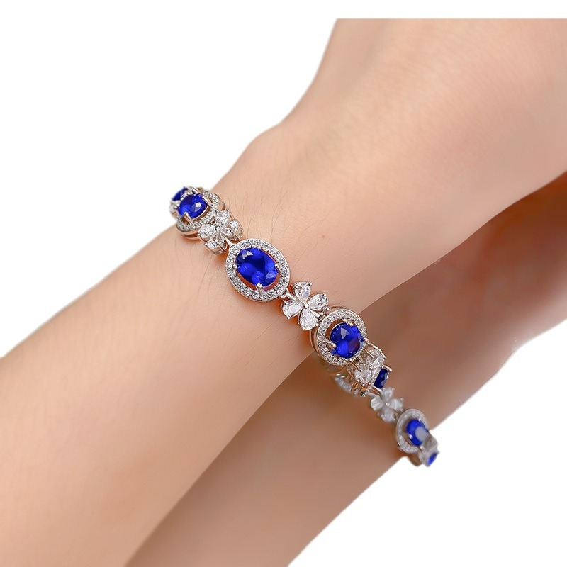 Sleek S925 Sterling Silver Bangle Adorned by Vibrant Oval Shape 6x8mm Royal Blue Sapphire Gemstone