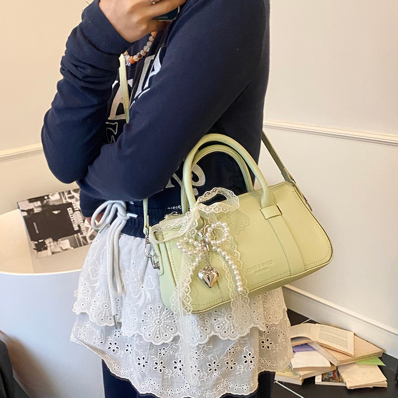 Korean version of fashionable hand-held pillow for women in summer 2025 simple and niche splicing style trendy crossbody bag
