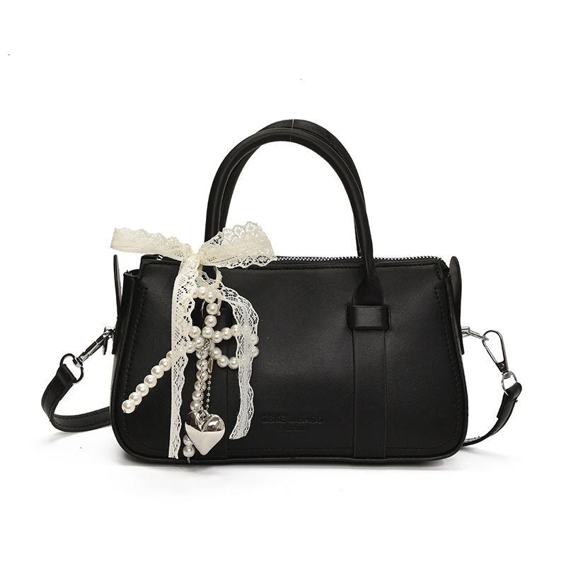 Korean version of fashionable hand-held pillow for women in summer 2025 simple and niche splicing style trendy crossbody bag