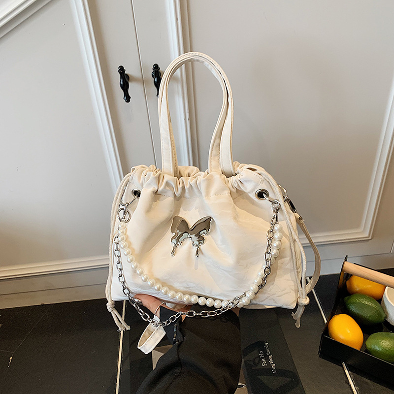 Free Delivery Designer Bag Silver Butterfly Women's 2025 Fashionable Korean Pearl Chain Backpack Versatile Hand Luxury Bag