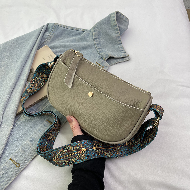 Genuine leather women's 2025 new style temperament top layer cowhide casual saddle fashionable wide shoulder strap crossbody bag