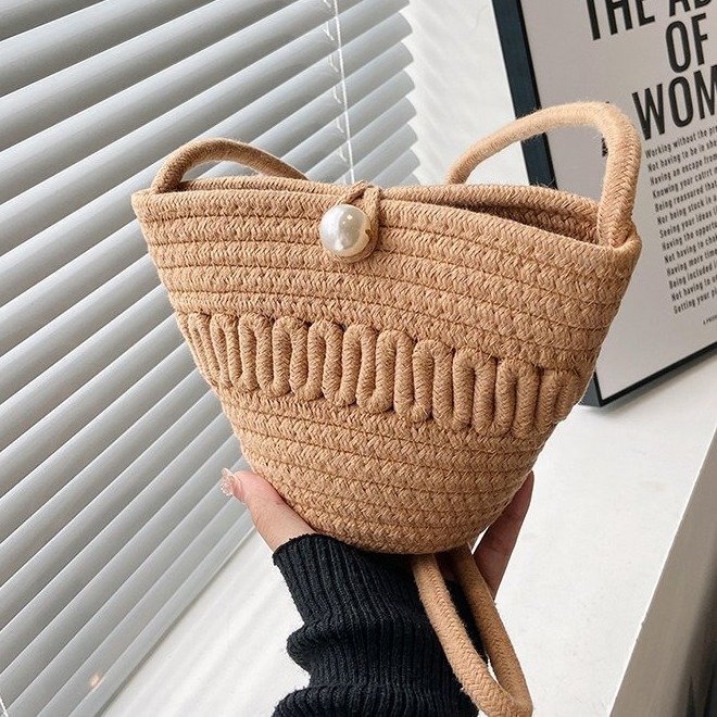 Summer new women's woven fashionable hand-held cross shoulder bucket shaped beach bag, bucket beach pleated cloud bag, casual fashion versatile p