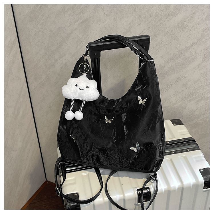 Women's large capacity butterfly decoration shoulder 2025 new fashionable commuting backpack multi-purpose tote bag