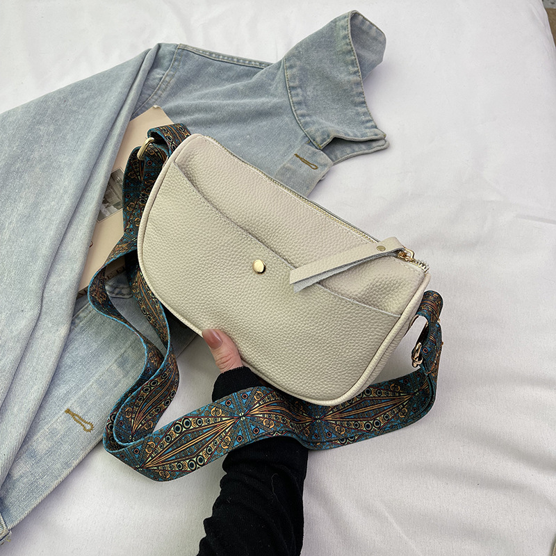 Genuine leather women's 2025 new style temperament top layer cowhide casual saddle fashionable wide shoulder strap crossbody bag