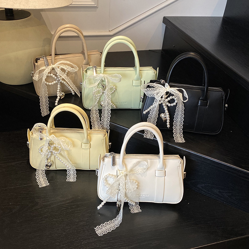 Korean version of fashionable hand-held pillow for women in summer 2025 simple and niche splicing style trendy crossbody bag