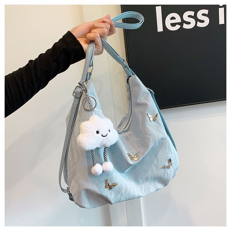 Women's large capacity butterfly decoration shoulder 2025 new fashionable commuting backpack multi-purpose tote bag