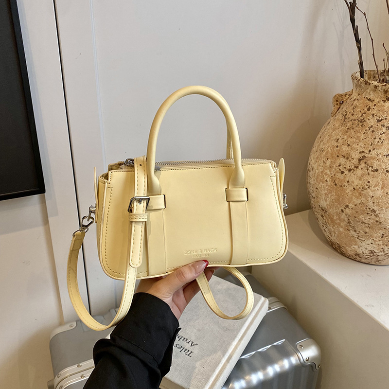Korean version of fashionable hand-held pillow for women in summer 2025 simple and niche splicing style trendy crossbody bag