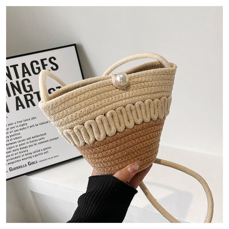 Summer new women's woven fashionable hand-held cross shoulder bucket shaped beach bag, bucket beach pleated cloud bag, casual fashion versatile p