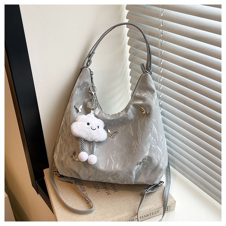 Women's large capacity butterfly decoration shoulder 2025 new fashionable commuting backpack multi-purpose tote bag