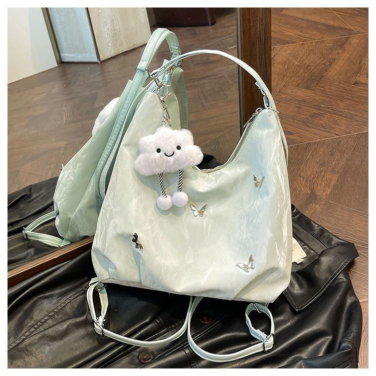 Women's large capacity butterfly decoration shoulder 2025 new fashionable commuting backpack multi-purpose tote bag