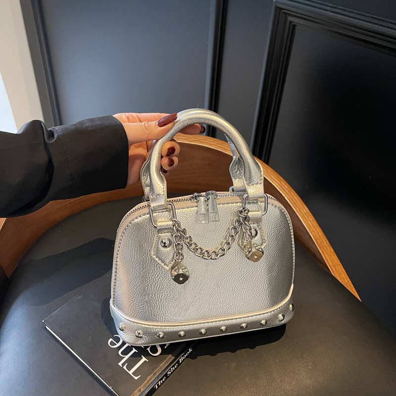 2025 new niche design high-end rivet hand-held shell versatile chain shoulder diagonal cross women's bag