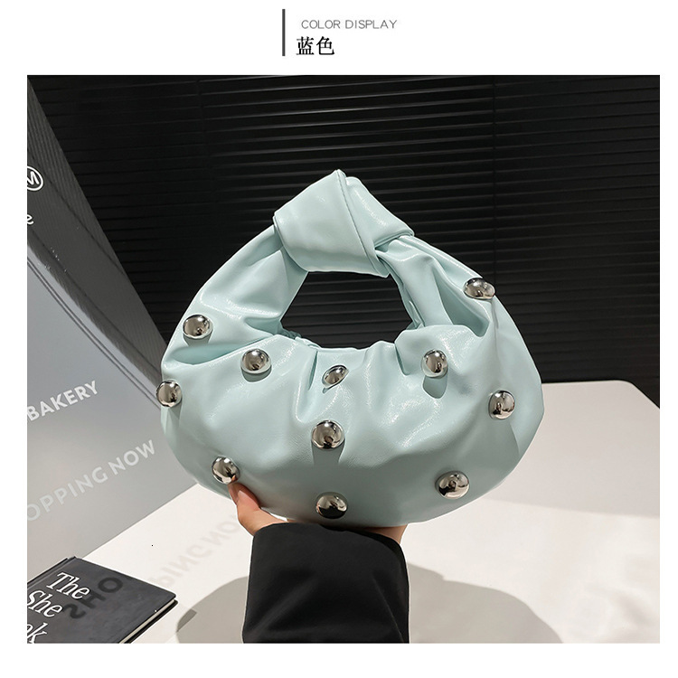 2025 new women's Korean version rivet personality fashion niche shoulder internet famous crossbody armpit bag