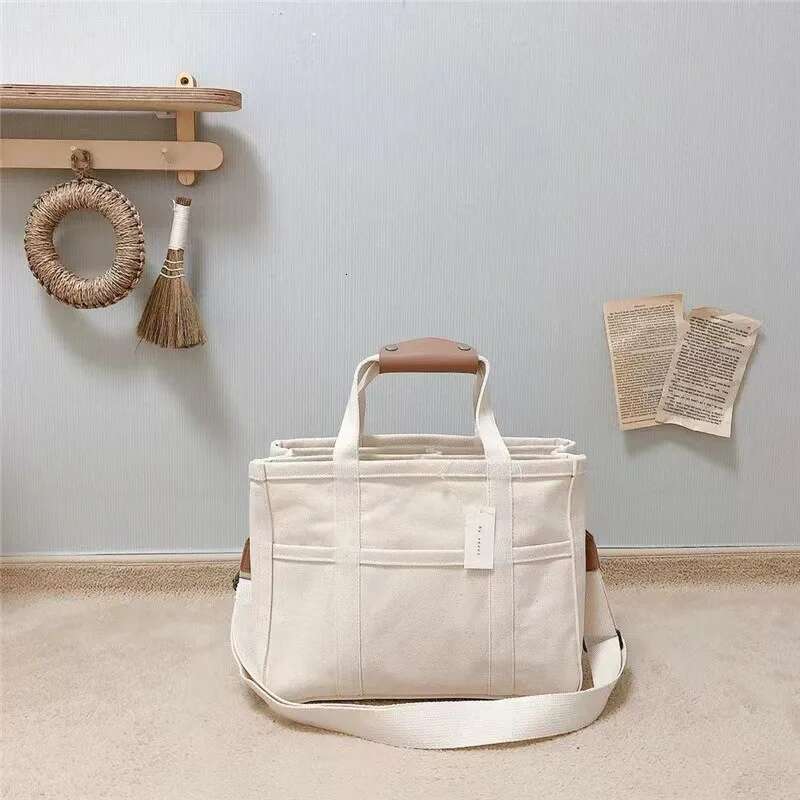 Fashionable multi-functional single-shoulder crossbody for and baby, hand-held canvas baby stroller, mother bag