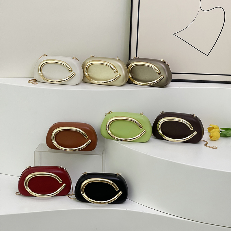 Small niche design, high-end metal decoration, hand-held box bag, new versatile chain shoulder crossbody women's bag