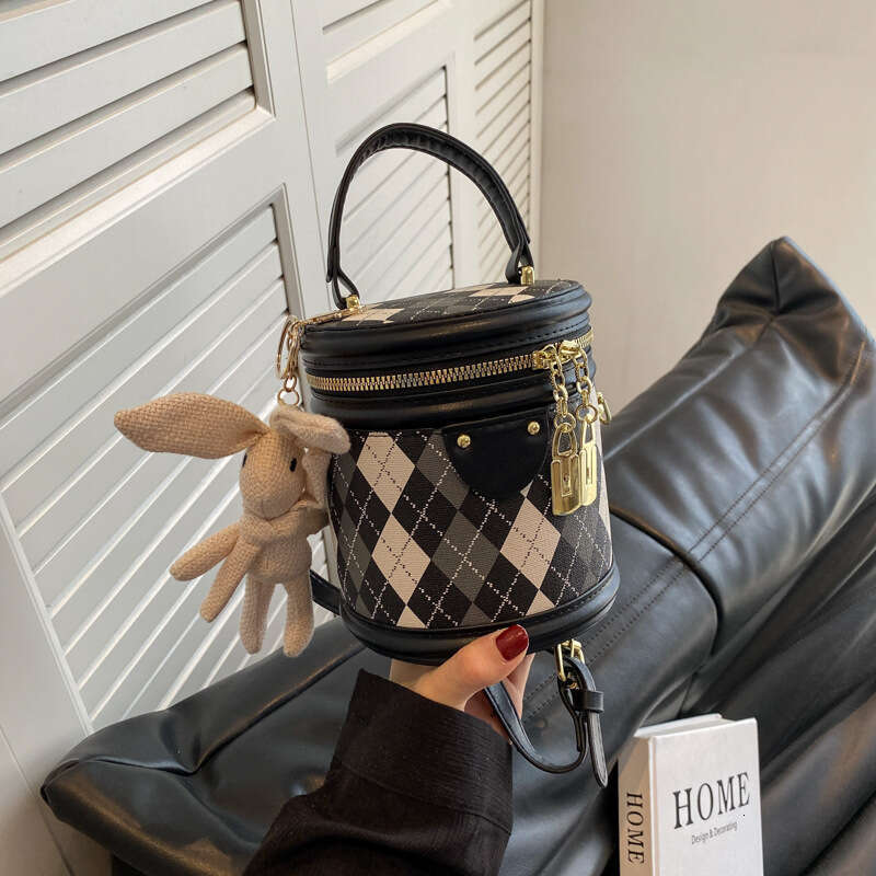 This year's popular small for women in the spring summer of 2025 are fashionable and niche crossbody with textured dia grid hand-held bucket bags