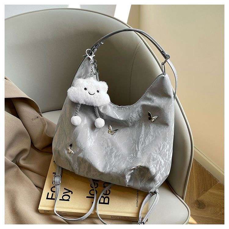 Women's large capacity butterfly decoration shoulder 2025 new fashionable commuting backpack multi-purpose tote bag
