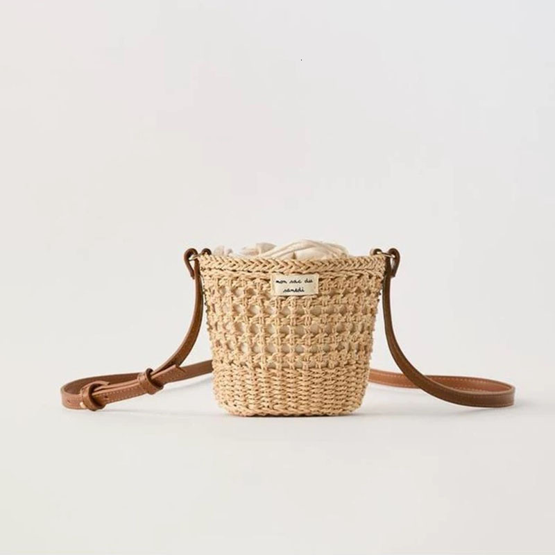 New Cute Bucket Bag Straw Weaving New Small Fresh Hollow One Shoulder Weaving Vacation Beach Bag Women's Bag Outward Travel Bag Retro Designer Ve