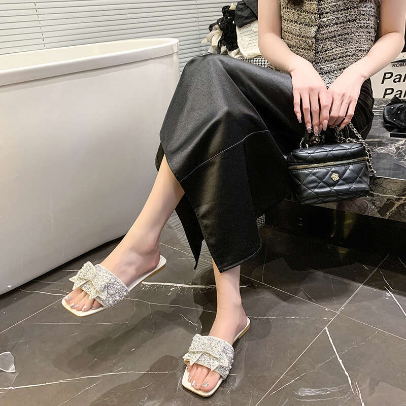 High quality one-piece slippers, female designer sandals, summer 2025 new butterfly knot sandals, light luxury outdoor beach slippers