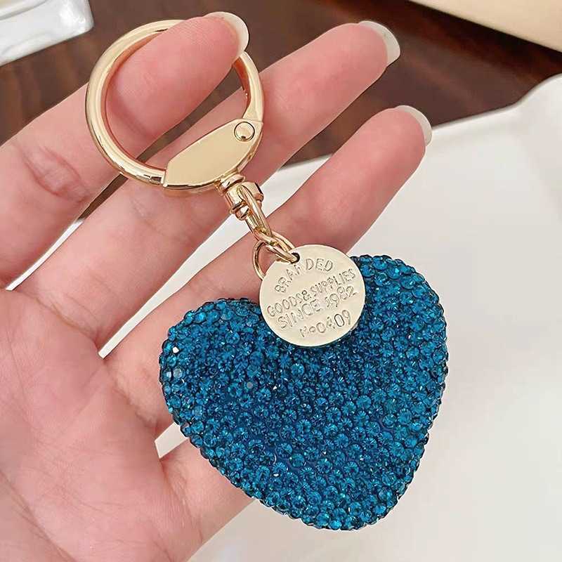 Shining diamond studded heart-shaped keychain, peach heart earphone cover, bag pendant, metal tag accessory