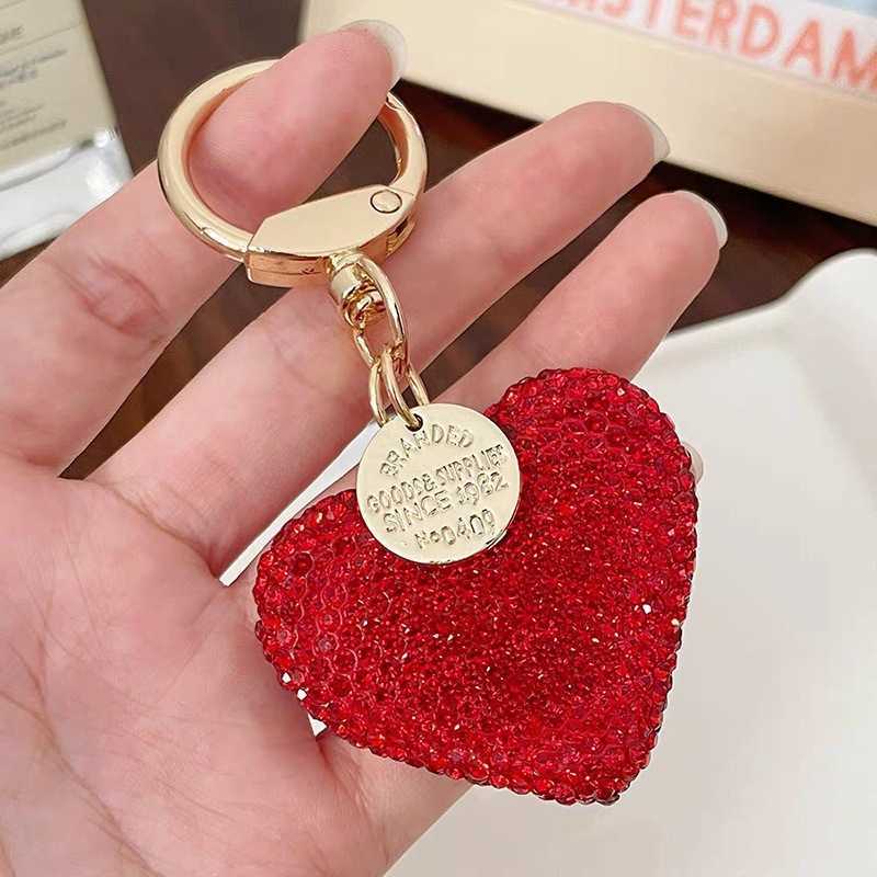 Shining diamond studded heart-shaped keychain, peach heart earphone cover, bag pendant, metal tag accessory