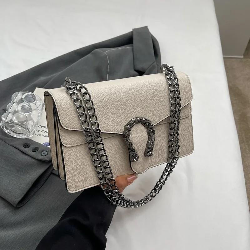 Free shipping fashion light luxury leather chain sling clamshell delicate small square bag solid color shoulder crossbody bag Europe and the United St