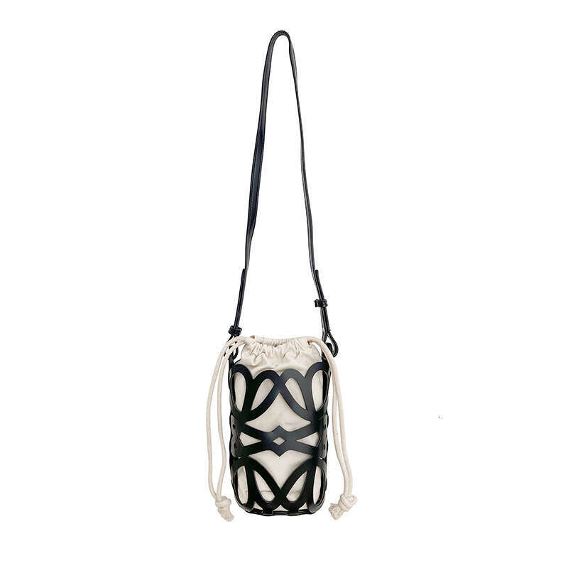 South Korea 2025 new bucket women's hollow drawstring canvas inner niche design fashionable versatile mini bag