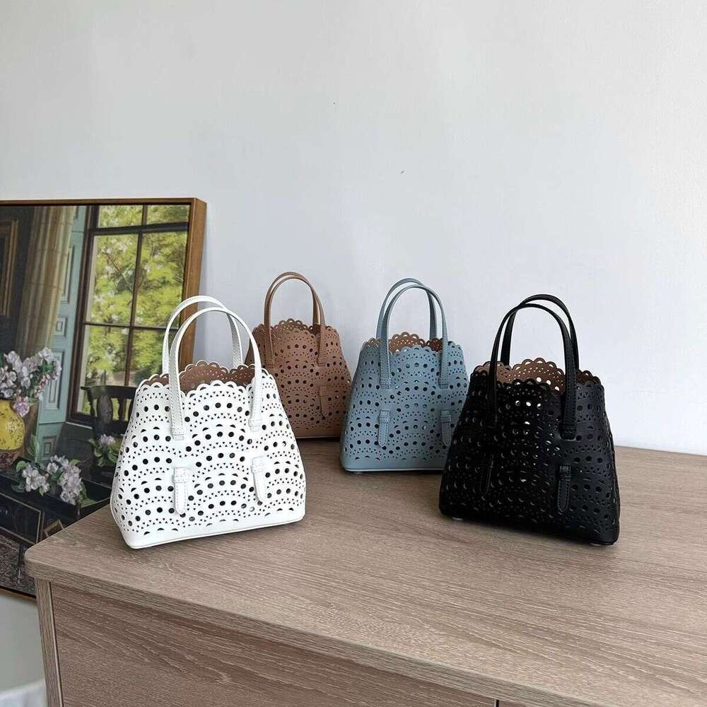 Niche carved pattern design genuine leather handbag hollowed out cowhide crossbody fashionable shoulder vegetable basket bag women's bag