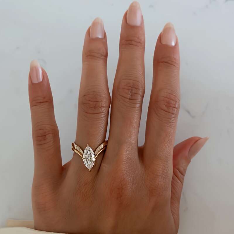 A two piece set of minimalist INS style S sterling Siery rings featuring oval Moissanite stone perfect for a unique and fashionable look